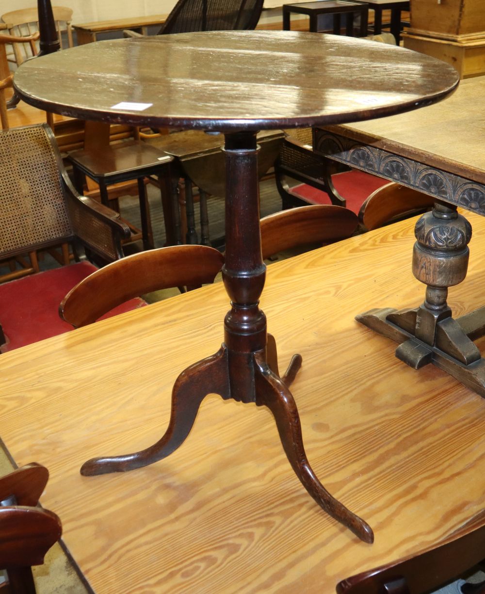 A George III oak tilt top tea table, diameter 66cm, H.72cm